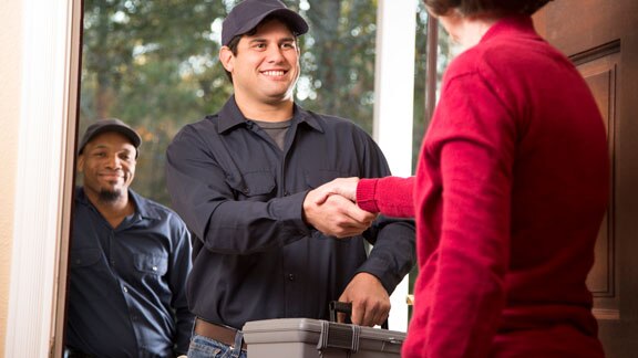 handyman handshake with client female