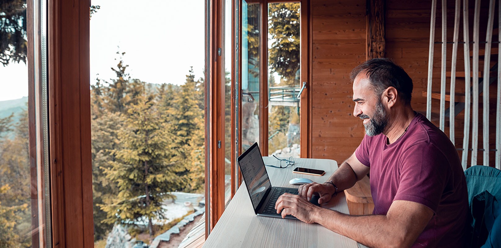 Man working on a laptop sitting at a desk
